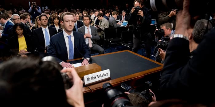 Mark Zuckerberg facing the US Senate in April 2018, after Cambridge Analytica — surrounded by more cameras than consequences.